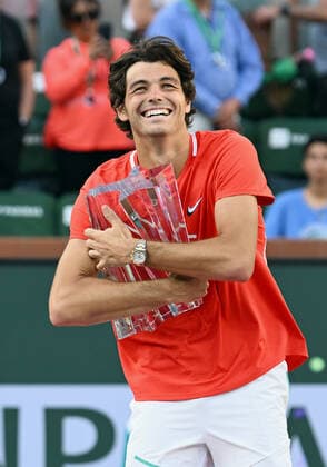INDIAN WELLS, CA - MARCH 20: Taylor Fritz of the United States posses with the championship trophy after winning the BNP Paribas Open on March 20, 2022 at the Indian Wells Tennis Garden in Indian Wells,CA. (Photo by John Cordes Icon Sportswire) TENNIS: MAR 20 BNP Paribas Open Women s Final Icon506220320205