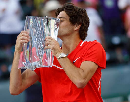 March 20, 2022 Taylor Fritz kisses the winner s trophy after defeating Rafael Nadal of Spain during the finals match of the 2022 BNP Paribas Open at Indian Wells Tennis Garden in Indian Wells, California. Indian Wells United States of America - ZUMAc04_ 20220320_zaf_c04_062 Copyright: xCharlesxBausx