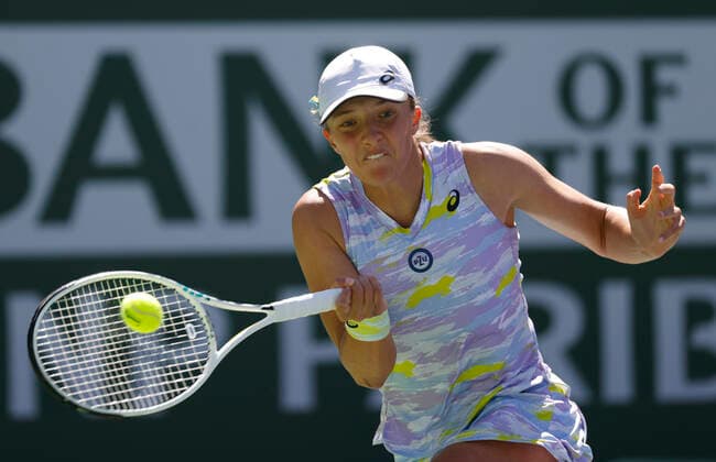 March 20, 2022 Iga Swiatek of Poland returns a shot against Maria Sakkari of Greece in the women s singles finals of the 2022 BNP Paribas Open at Indian Wells Tennis Garden in Indian Wells, California. Indian Wells United States of America - ZUMAc04_ 20220320_zaf_c04_101 Copyright: xCharlesxBausx