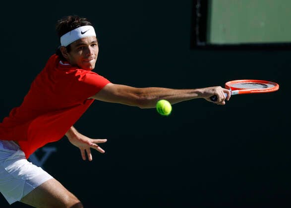 March 20, 2022 Taylor Fritz returns a shot against Rafael Nadal of Spain during the finals match of the 2022 BNP Paribas Open at Indian Wells Tennis Garden in Indian Wells, California. Indian Wells United States of America - ZUMAc04_ 20220320_zaf_c04_145 Copyright: xCharlesxBausx