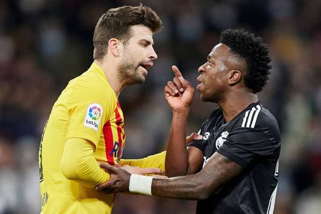 Mandatory Credit: Photo by Pressinphoto Shutterstock (12859387dq) Gerard Pique of FC Barcelona, Barca and Vinicius Jr. of Real Madrid Real Madrid v FC Barcelona, La Liga 2021-2022, date 29. Football, Santiago Bernabeu Stadium, Madrid, Spain - 20 Mar 2022 EDITORIAL USE ONLY No use with unauthorised audio, video, data, fixture lists (outside the EU), club league logos or live services. Online in-match use limited to 45 images (+15 in extra time). No use to emulate moving images. No use in betting, games or single club league player publications services. Real Madrid v FC Barcelona, La Liga 2021-2022, date 29. Football, Santiago Bernabeu Stadium, Madrid, Spain - 20 Mar 2022 EDITORIAL USE ONLY No use with unauthorised audio, video, data, fixture lists (outside the EU), club league logos or live services. Online in-match use limited to 45 images (+15 in extra time). No use to emulate moving images. No use in betting, games or Copyright: xPressinphoto Shutterstockx 12859387dq