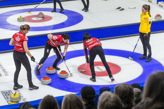 March 23, 2022, Prince George, BC, Canada: From left, Canada lead Briane Meilleur, second Shannon Birchard, and skip Kerri Einarson sweep in front of a stone as Sweden skip Anna Hasselborg at the Women s World Curling Championship in Prince George, B.C., on Wednesday, March 23, 2022. Canada News - March 23, 2022 - ZUMAc35_ 20220323_zaf_c35_096 Copyright: xJamesxDoylex