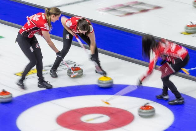 March 23, 2022, Prince George, BC, Canada: From left, Canada lead Briane Meilleur, second Shannon Birchard, and skip Kerri Einarson sweep in front of a stone against Sweden at the Women s World Curling Championship in Prince George, B.C., on Wednesday, March 23, 2022. Canada News - March 23, 2022 - ZUMAc35_ 20220323_zaf_c35_098 Copyright: xJamesxDoylex