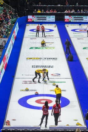 March 23, 2022, Prince George, BC, Canada: Canada skip Kerri Einarson, front left, and third Val Sweeting look on with Sweden skip Anna Hasselborg while Sweden Anges Knochenhauer, middle left, and lead Sofia Mabergs sweep in front of a stone, as Sweden third Sara McManus watches her throw with Canada lead Briane Meilleur, rear left, and second Shannon Birchard look on at the Women s World Curling Championship in Prince George, B.C., on Wednesday, March 23, 2022. Canada News - March 23, 2022 - ZUMAc35_ 20220323_zaf_c35_100 Copyright: xJamesxDoylex