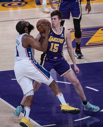 March 23, 2022, Los Angeles, California, USA: James Harden 1 of the Philadelphia 76ers is defended by Austin Reaves 15 of the Los Angeles Lakers as he puts up a layup during their NBA, Basketball Herren, USA game on Wednesday March 23, 2022 at Crypto.com Arena in Los Angeles, California. PI Los Angeles USA - ZUMAp124 20220323_zaa_p124_012 Copyright: xJAVIERxROJASx