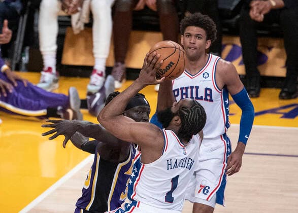 March 23, 2022, Los Angeles, California, USA: Wenyen Gabriel 35 of the Los Angeles Lakers tries to block James Harden 1 of the Philadelphia 76ers as he goes to the basket during their NBA, Basketball Herren, USA game on Wednesday March 23, 2022 at Crypto.com Arena in Los Angeles, California. Lakers lose to 76ers, 121-126. PI Los Angeles USA - ZUMAp124 20220323_zaa_p124_019 Copyright: xJAVIERxROJASx
