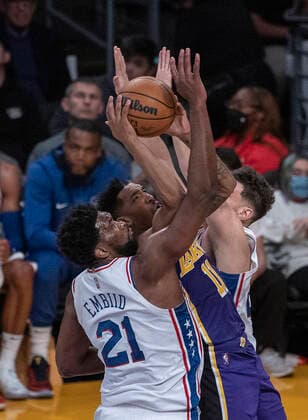 March 23, 2022, Los Angeles, California, USA: Malik Monk 11 of the Los Angeles Lakers as blocked by Philadelphia 76ers defenders as he goes to the basket during their NBA, Basketball Herren, USA game on Wednesday March 23, 2022 at Crypto.com Arena in Los Angeles, California. Lakers lose to 76ers, 121-126. PI Los Angeles USA - ZUMAp124 20220323_zaa_p124_023 Copyright: xJAVIERxROJASx