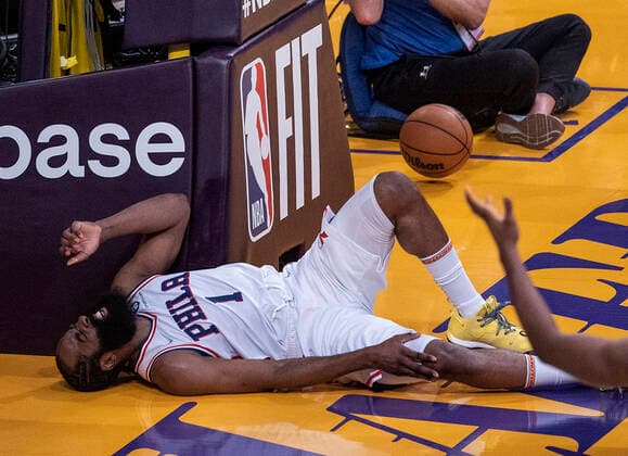 March 23, 2022, Los Angeles, California, USA: James Harden 1 of the Philadelphia 76ers grimmeces in pain after going down on a blocked shot by the Los Angeles Lakers defenders during their NBA, Basketball Herren, USA game on Wednesday March 23, 2022 at Crypto.com Arena in Los Angeles, California. PI Los Angeles USA - ZUMAp124 20220323_zaa_p124_029 Copyright: xJAVIERxROJASx