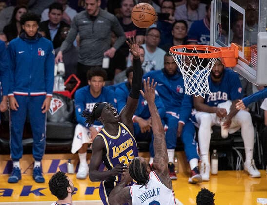 March 23, 2022, Los Angeles, California, USA: Wenyen Gabriel 35 of the Los Angeles Lakers puts up a shot over DeAndre Jordan 9 of the Philadelphia 76ers during their NBA, Basketball Herren, USA game on Wednesday March 23, 2022 at Crypto.com Arena in Los Angeles, California. Lakers lose to 76ers, 121-126. PI Los Angeles USA - ZUMAp124 20220323_zaa_p124_036 Copyright: xJAVIERxROJASx