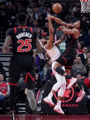 March 24, 2022, TORONTO, ON, CANADA: Toronto Raptors forward Scottie Barnes (4) rejects Cleveland Cavaliers forward Lamar Stevens (8) as Toronto Raptors forward Chris Boucher (25) looks on during first half NBA, Basketball Herren, USA basketball action in Toronto, Thursday, March 24, 2022. Canada News - March 24, 2022 - ZUMAc35_ 20220324_zaf_c35_176 Copyright: xNathanxDenettex