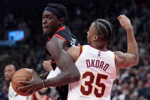 March 24, 2022, TORONTO, ON, CANADA: Toronto Raptors forward Pascal Siakam (43) tries to move the ball around Cleveland Cavaliers forward Isaac Okoro (35) during first half NBA, Basketball Herren, USA basketball action in Toronto, Thursday, March 24, 2022. Canada News - March 24, 2022 - ZUMAc35_ 20220324_zaf_c35_181 Copyright: xNathanxDenettex