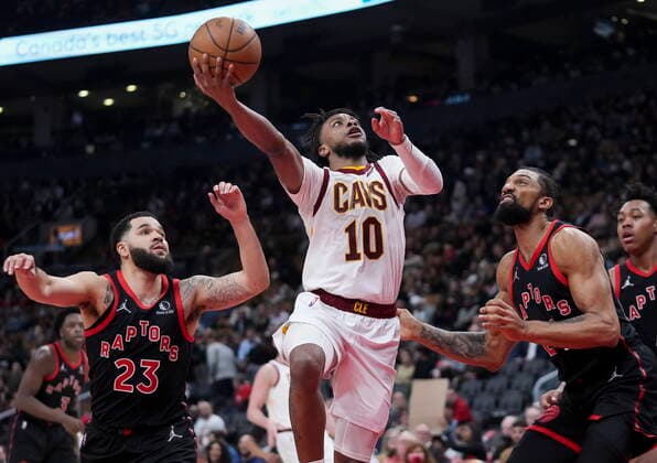 March 24, 2022, TORONTO, ON, CANADA: Cleveland Cavaliers guard Tim Frazier (10) drives to the net past Toronto Raptors guard Fred VanVleet (23) and Raptors guard Svi Mykhailiuk (14) during second half NBA, Basketball Herren, USA basketball action in Toronto on Thursday, March 24, 2022. Canada News - March 24, 2022  - ZUMAc35_ 20220324_zaf_c35_213 Copyright: xNathanxDenettex