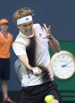 Alexander Zverev from Germany returns a forehand shot back to Borna Coric from Croatia at the Miami Open in the Hard Rock Stadium in Miami Gardens, Florida, on Friday, March 25, 2022. Zverev defeated Coric 6-4, 3-6, 6-4 in three sets.  MIA20220325114 GARYxIxROTHSTEIN