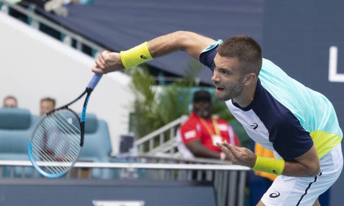 Borna Coric from Croatia serves to Alexander Zverev from Germany at the Miami Open in the Hard Rock Stadium in Miami Gardens, Florida, on Friday, March 25, 2022. Zverev defeated Coric 6-4, 3-6, 6-4 in three sets.  MIA20220325117 GARYxIxROTHSTEIN