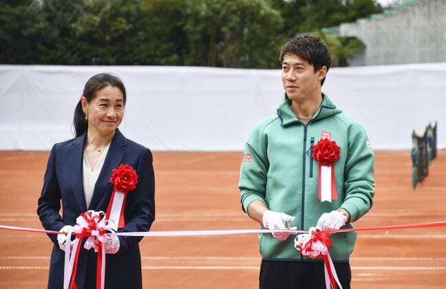 New clay court tennis venue in Tokyo Tennis player Kei Nishikori (R) and former tennis player Kimiko Date cut a tape during an event in Tokyo on March 26, 2022, to celebrate the completion of clay courts like those at Roland Garros in Paris.  A14AA0001273259P