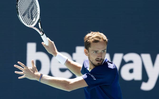 Daniil Medvedev from Russia returns a forehand shot to Andy Murray from Great Britain at the Miami Open in the Hard Rock Stadium in Miami Gardens, Florida, on Saturday, March 26, 2022.  MIA20220326103 GARYxIxROTHSTEIN