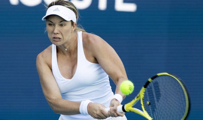 Danielle Collins from the USA hits a two hand backhand to Vera Zvonareva at the Miami Open in the Hard Rock Stadium in Miami Gardens, Florida, on Saturday, March 26, 2022. Collins defeated Zvonareva 6-1, 6-4.  MIA20220326112 GARYxIxROTHSTEIN