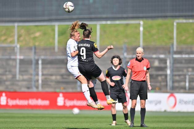 Headers duel Lisanne Gräwe B04, 5 Adriana Achcinska FC Cologne, 9 , 27 03 2022, Cologne Germany , Football, Flyeralarm Frauen Bundesliga, 1 FC Köln Bayer 04 Leverkusen xmkx