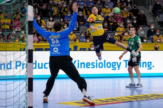 f l Dejan Milosavljev goalkeeper, foxes, 96 , Patrick Groetzki RNL, 24 , Milos Vujovic foxes, 66 , during jump shot, throw, goal throw, action, game scene, 27 03 2022, Mannheim Germany , Handball, Bundesliga, Rhein Neckar Löwen foxes Berlin xozx