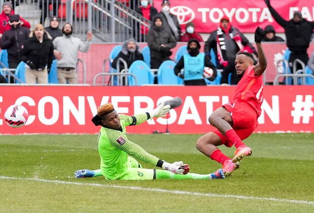 March 27, 2022, TORONTO, ON, CANADA: Canada s Cyle Larin scores past Jamaica s goalkeeper Andre Blake during first half CONCACAF World Cup soccer qualifying action in Toronto on Sunday, March 27, 2022. Canada News - March 27, 2022  - ZUMAc35_ 20220327_zaf_c35_146 Copyright: xNathanxDenettex