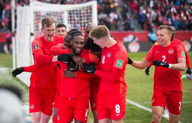 (220328) -- TORONTO, March 28, 2022 -- Junior Hoilett (C) of Canada celebrates scoring with teammates during the FIFA World Cup, WM, Weltmeisterschaft, Fussball CONCACAF qualifiers match between Canada and Jamaica in Toronto, Canada, on March 27, 2022. (Photo by Zou Zheng Xinhua) (SP)CANADA-TORONTO-SOCCER-FIFA WORLD CUP QUALIFICATION-CANADA VS JAMAICA LinxWei 