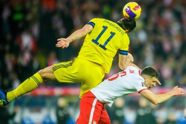 220329 Zlatan Ibrahimovic of Sweden and Krystian Bielik of Poland during the FIFA World Cup Qualifier play off final between Poland and Sweden on March 29, 2022 in Katowice Photo Ludvig Thunman BILDBYRAN kod LT JM0300 bbeng fotboll football soccer fotball vm kval kval fifa world cup qualifier landskamp play off playoff sverige sweden sverige a polen poland,  Copyright: LUDVIGxTHUNMAN BB220329LT145