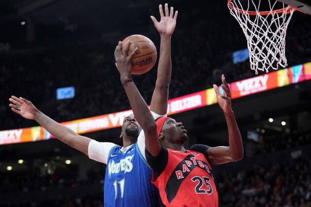 March 30, 2022, TORONTO, ON, CANADA: Toronto Raptors forward Chris Boucher (25) gets his dunk rejected by Minnesota Timberwolves centre Naz Reid (11) during first half NBA, Basketball Herren, USA basketball action in Toronto, Wednesday, March 30, 2022. Canada News - March 30, 2022  - ZUMAc35_ 20220330_zaf_c35_141 Copyright: xNathanxDenettex