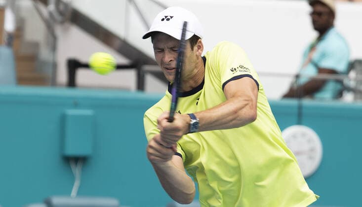 Hubert Hurkacz from Poland returns a two handed backhand to Daniil Medvedev from Russia during the quarter-finals at the Miami Open in the Hard Rock Stadium in Miami Gardens, Florida, on Thursday, March 31, 2022. Hurkacz defeated Medvedev 7-6, 6-3.  MIA20220331104 GARYxIxROTHSTEIN