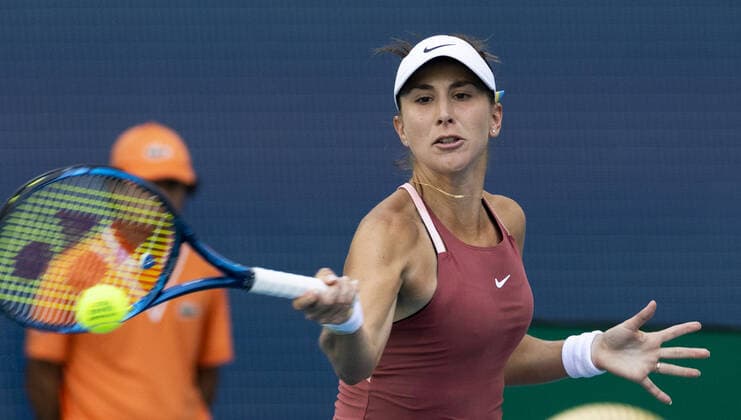 Belinda Bencic from Switzerland returns a forehand shot to Naomi Osaka from Japan during the semi-finals at the Miami Open in the Hard Rock Stadium in Miami Gardens, Florida, on Thursday, March 31, 2022.  MIA20220331120 GARYxIxROTHSTEIN