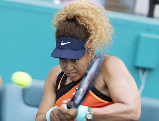 Naomi Osaka from Japan returns a two handed backhand shot to Belinda Bencic from Switzerland during the semi-finals at the Miami Open in the Hard Rock Stadium in Miami Gardens, Florida, on Thursday, March 31, 2022. Osaka Defeated Bencic 4-6, 6-3, 6.4. to move to the finals.  MIA20220331127 GARYxIxROTHSTEIN
