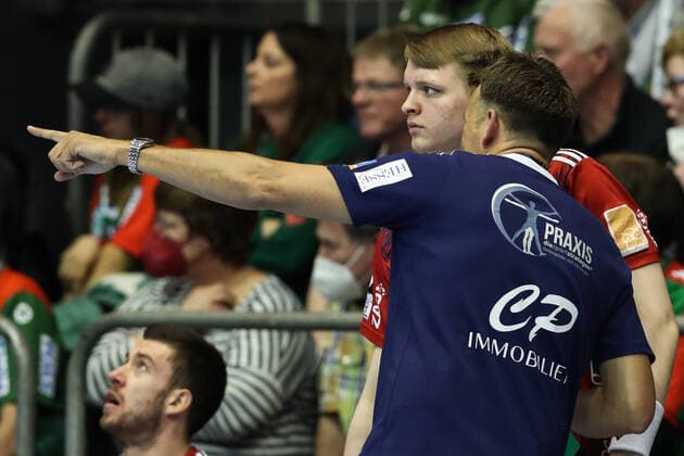 Coach Christian Prokop with Justus Fischer TSV Hannover Burgdorf,54 Handball Bundesliga season 2021 2022 SC Magdeburg vs TSV Hannover Burgdorf at GETEC Arena in Magdeburg man,men,handball,Germany,31 03 2022