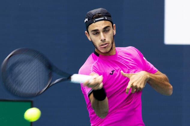 Francisco Cerundolo from Argentina returns a forehand shot to Casper Ruud from Norway during the semi-finals at the Miami Open in the Hard Rock Stadium in Miami Gardens, Florida, on Friday, April 1, 2022. Ruud defeated Cerundolo 6-4, 6-1 to advance to the finals.  MIA20220401103 GARYxIxROTHSTEIN