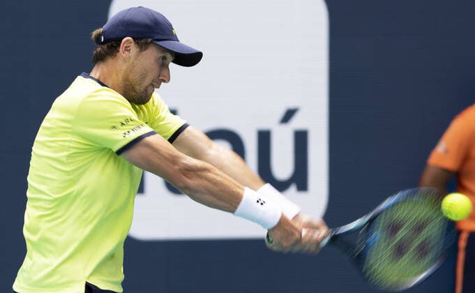 Casper Ruud from Norway returns a two handed backhand shot to Francisco Cerundolo from Argentina during the semi-finals at the Miami Open in the Hard Rock Stadium in Miami Gardens, Florida, on Friday, April 1, 2022. Ruud defeated Cerundolo 6-4, 6-1 to advance to the finals.  MIA20220401108 GARYxIxROTHSTEIN