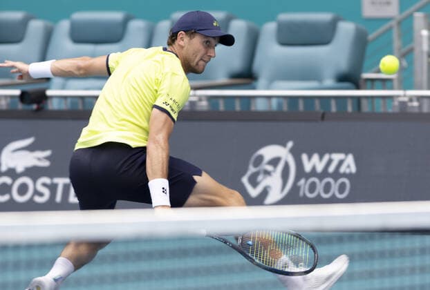 Casper Ruud from Norway returns the ball at the net to Francisco Cerundolo from Argentina during the semi-finals at the Miami Open in the Hard Rock Stadium in Miami Gardens, Florida, on Friday, April 1, 2022. Ruud defeated Cerundolo 6-4, 6-1 to advance to the finals.  MIA20220401113 GARYxIxROTHSTEIN