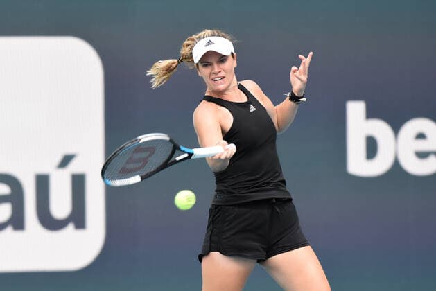 MIAMI GARDENS, FL - APRIL 1: Catherine McNally hits a forehand during the Women™s doubles semifinal for the Miami Open on April 1, 2022, at Hard Rock Stadium in Miami Gardens, Florida. (Photo by Michele Eve Sandberg Icon Sportswire) TENNIS: APR 01 Miami Open Icon220401669