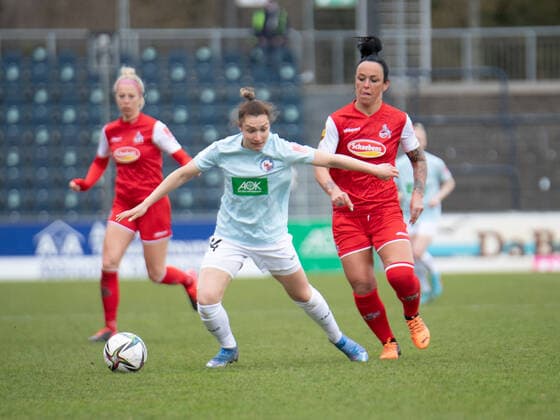 Sophie Weidauer 14 Potsdam and Peggy Kuznik 21 FC Cologne in action during the Flyeralarm womens Bundesliga match 1 FFC Turbine Potsdam 1 FC Köln on 02 04 2022 Potsdam Karl Liebnkecht Stadion Brandenburg Germany