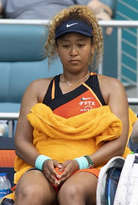 Naomi Osaka from Japan sits during a change over in her match against Iga Swiatek from Poland during the women s finals at the Miami Open in the Hard Rock Stadium in Miami Gardens, Florida, on Saturday, April 2, 2022.  MIA20220402127 GARYxIxROTHSTEIN