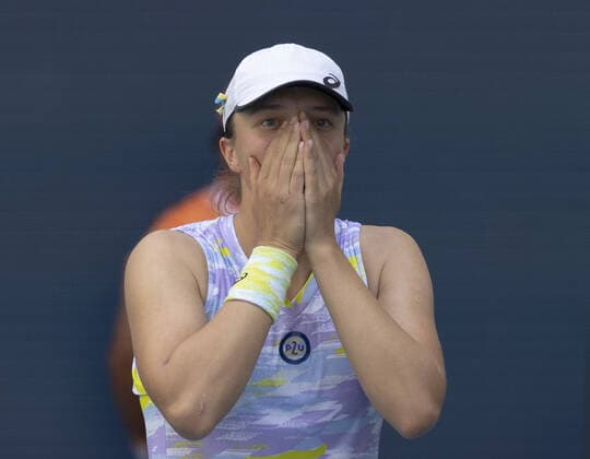 Iga Swiatek from Poland reacts after defeating Naomi Osaka from Japan during the women s final at the Miami Open in the Hard Rock Stadium in Miami Gardens, Florida, on Saturday, April 2, 2022. Swiatek defeated Osaka 6-4, 6-0 winning the women s championship.  MIA20220402124 GARYxIxROTHSTEIN