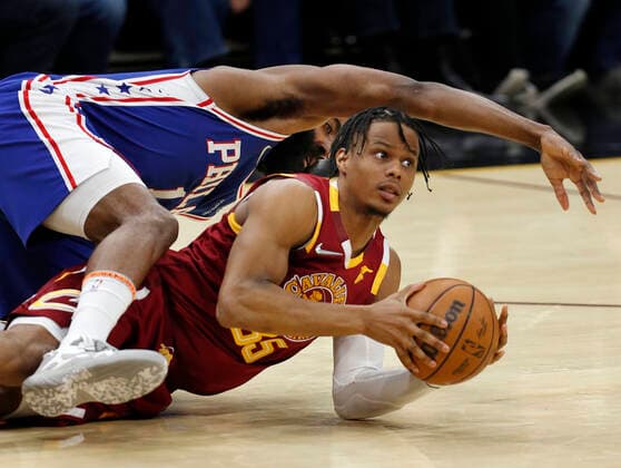 Cleveland Cavaliers guard Isaac Okoro (R) looks to pass the ball as Philadelphia 76ers guard James Harden (L) falls on top of him during the second half of the NBA, Basketball Herren, USA game between the Cleveland Cavaliers and the Philadelphia 76ers at Rocket Mortgage Fieldhouse in Cleveland, Ohio, USA, 3, April 2022. Philadelphia 76ers at Cleveland Cavaliers !ACHTUNG: NUR REDAKTIONELLE NUTZUNG!  Copyright: xDAVIDxMAXWELLx AME8677 20220404-00765ab2a9376d8e9ffac6c8b4549a5d69988449