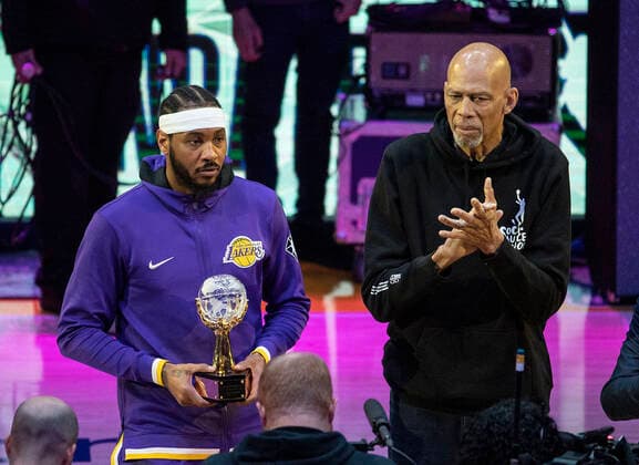 April 3, 2022, LOS ANGELES, CALIFORNIA, USA: Retired basketball player Kareem Abdul-Jabbar presents the Trophy for the leagueÃ¢â‚¬â ¢s annual Social Justice Champion award to Carmelo Anthony 7 of the Los Angeles Lakers prior to a game against the Denver Nuggets at Crypto.com Arena on April 03, 2022 in Los Angeles, California. Lakers lose to Nuggets, 118-129. PI LOS ANGELES USA - ZUMAp124 20220403_zaa_p124_060 Copyright: xJAVIERxROJASx