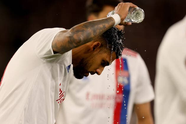7th April 2022, London Stadium, London, England; Europa League football West Ham versus Lyon; Emerson Palmieri of Lyon covers himself in water before kick off  ActionPlus12376207 ShaunxBrooks