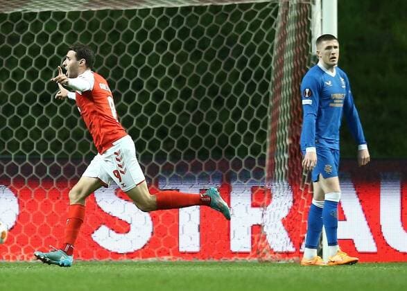 Mandatory Credit: Photo by Michael Zemanek Shutterstock (12885087s) Abel Ruiz of Braga celebrates scoring the opening goal while John Lundstram of Rangers looks dejected Braga v Rangers, UEFA Europa League, Quarter Final, First Leg, Football, Estadio Municipal de Braga, Braga, Portugal - 07 Apr 2022 EDITORIAL USE ONLY No use with unauthorised audio, video, data, fixture lists, club league logos or live services. Online in-match use limited to 120 images, no video emulation. No use in betting, games or single club league player publications. Braga v Rangers, UEFA Europa League, Quarter Final, First Leg, Football, Estadio Municipal de Braga, Braga, Portugal - 07 Apr 2022 EDITORIAL USE ONLY No use with unauthorised audio, video, data, fixture lists, club league logos or live services. Online in-match use limited to 120 images, no video emulation. No use in betting, games or single club league player publications.  Copyright: xMichaelxZemanek Shutterstockx 12885087s