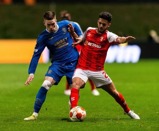 Mandatory Credit: Photo by Luke Nickerson Rangers FC Shutterstock (12885361y) Ryan Kent of Rangers battles for the ball with Braga Defender Yan Couto during the Europa League quarter final match at the Municipal Stadium, Braga. Braga v Rangers, UEFA Europa League, Quarter Final, First Leg, Football, Estadio Municipal de Braga, Braga, Portugal - 07 Apr 2022 EDITORIAL USE ONLY No use with unauthorised audio, video, data, fixture lists, club league logos or live services. Online in-match use limited to 120 images, no video emulation. No use in betting, games or single club league player publications. Braga v Rangers, UEFA Europa League, Quarter Final, First Leg, Football, Estadio Municipal de Braga, Braga, Portugal - 07 Apr 2022 EDITORIAL USE ONLY No use with unauthorised audio, video, data, fixture lists, club league logos or live services. Online in-match use limited to 120 images, no video emulation. No use in betting, games or single club league player publications.  Copyright: xLukexNickerson RangersxFC Shutterstockx 12885361y