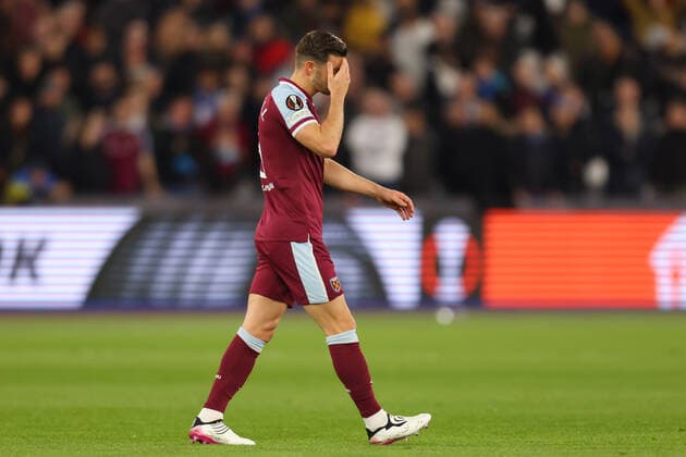 7th April 2022, London Stadium, London, England; Europa League football West Ham versus Lyon; A dejected Aaron Cresswell of West Ham United walks off the pitch as he is shown a red card  ActionPlus12376219 ShaunxBrooks
