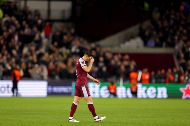 7th April 2022, London Stadium, London, England; Europa League football West Ham versus Lyon; A dejected Aaron Cresswell of West Ham United walks off the pitch as he is shown a red card  ActionPlus12376221 ShaunxBrooks