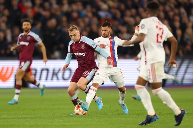 7th April 2022, London Stadium, London, England; Europa League football West Ham versus Lyon; Houssem Aouar of Lyon challenges Jarrod Bowen of West Ham United  ActionPlus12376333 ShaunxBrooks