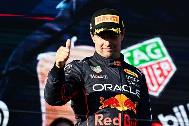 MELBOURNE, AUSTRALIA - APRIL 10: Second place Sergio Perez (11) of Mexico and Oracle Red Bull Racing on the podium at the Australian Formula One Grand Prix at Albert Park on April 10, 2022 in Melbourne, Australia. (Photo by Steven Markham Icon Sportswire) AUTO: APR 10 F1 - Australian Grand Prix Icon22041013561