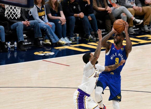Denver Nuggets guard Davon Reed (R) goes up for a shot against Los Angeles Lakers guard D.J. Augustin, during a NBA, Basketball Herren, USA game at the Ball Arena in Denver, CO, USA, 10 April 2022. Denver Nuggets - Los Angeles Lakers !ACHTUNG: NUR REDAKTIONELLE NUTZUNG!  Copyright: xToddxPiersonx AME490 20220411-a578d50a089acf6d5c84c5dc9c7bf625b109ee1d