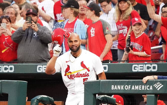 St. Louis Cardinals designated hitter Albert Pujols comes up for a curtain call after hitting his 680 career home run in the first inning against the Kansas City Royals at Busch Stadium in St. Louis on Tuesday, April 12, 2022.  SLP2022041212 BILLxGREENBLATT