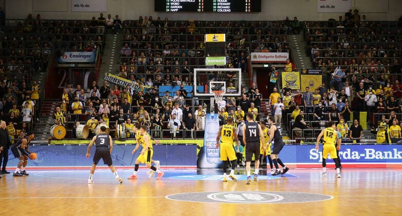Ludwigsburg , Basketball Champions League quarterfinal game 2 , MHP Riesen Ludwigsburg vs U BT Cluj Napoca , game scene in front of full tribune , fans spectators , the yellow wall